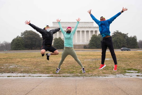Young, Foley, and Jolly all jumping behind the Lincoln Memorial on a grey day.