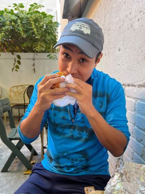 Vince Fuentes eating a sandwich
