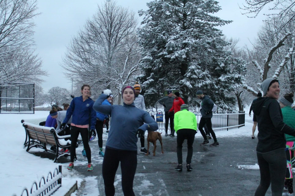Gail throwing a snowball at the camera as folks are gathering toward the end of one of our winter workouts. 